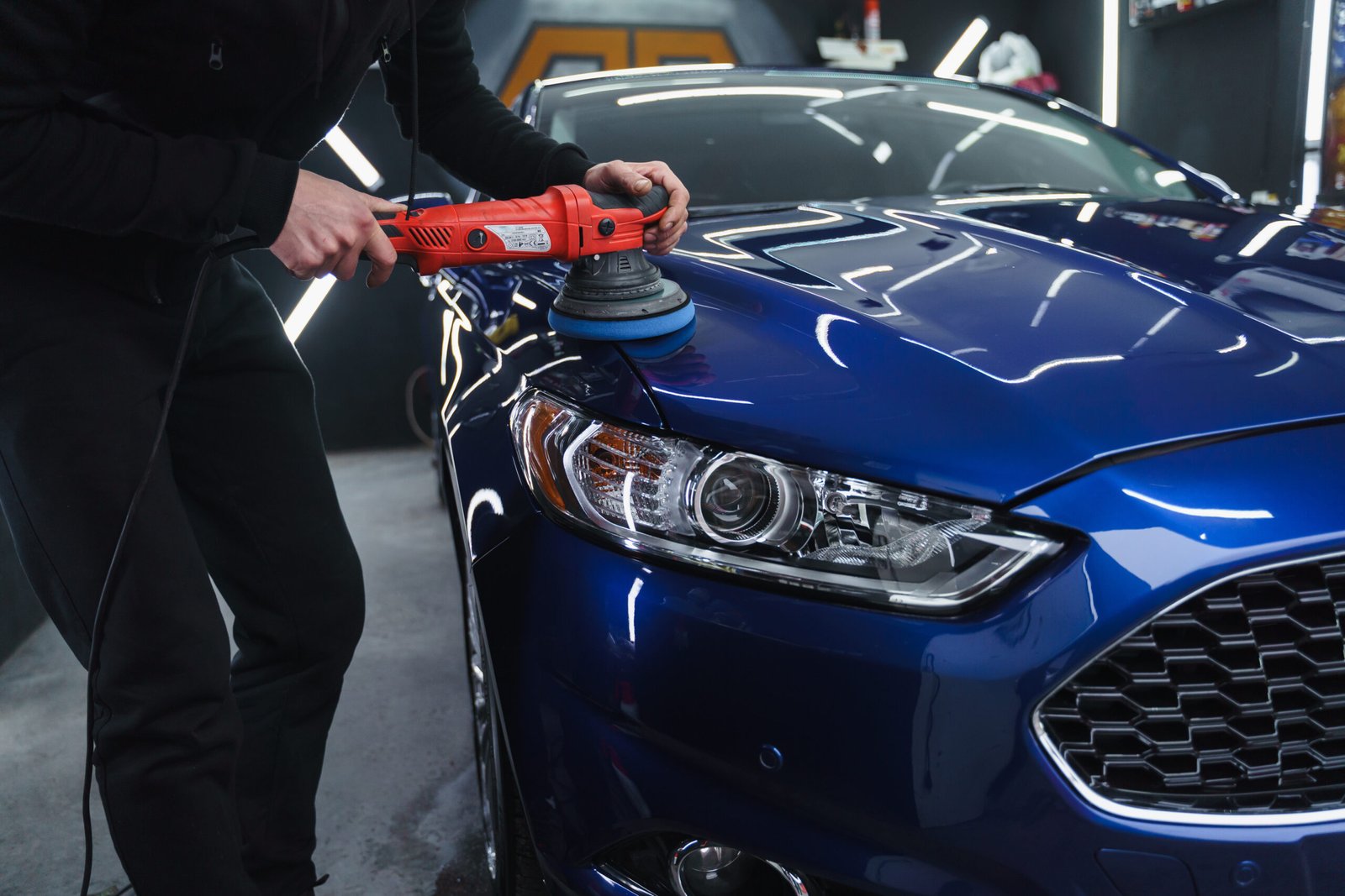 polishing-car-after-painting-detailing-car-from-outside-device-polishing-hands-scaled.jpg